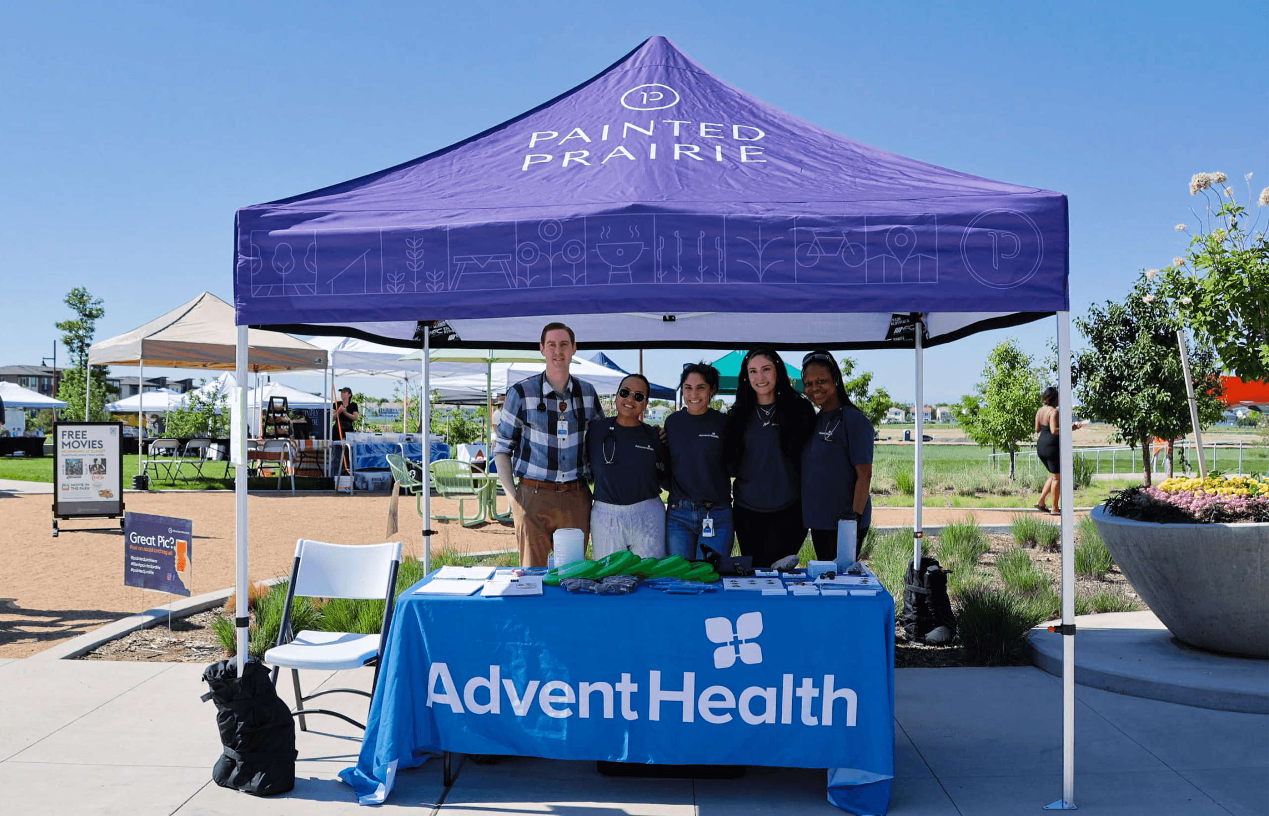 AdventHealth at Painted Prairie under a purple Painted Prairie branded tent at an Open-Air Market event